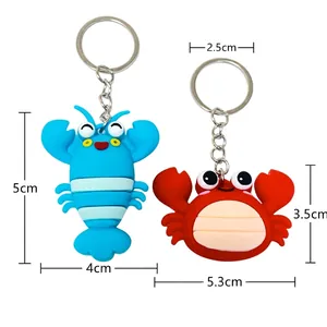 Cartoon lobster and crab keychain charms with measurement annotations