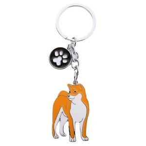 Kreativer Metall-Schlüsselanhänger mit Shiba Inu Hund und schwarzem Pfotenabdruck