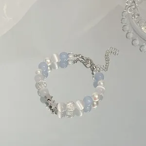 Elegant beaded bracelet with blue and white stones and silver star charms