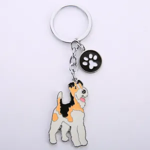 Metalen huisdier sleutelhanger met driekleurige Terrier hond en pootafdruk hanger