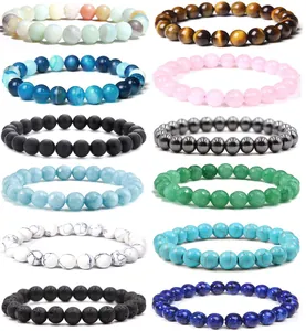Detailed view of 8mm natural stone beaded bracelets including rose quartz and tiger eye