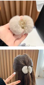 Elegant plush fur ball hair claw clip shown in hand and on hair for autumn winter fashion