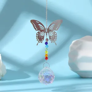 Close-up of a silver butterfly suncatcher featuring rainbow beads and a crystal prism ball