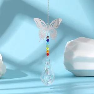 Close-up of silver butterfly suncatcher with rainbow beads and AB crystal drop