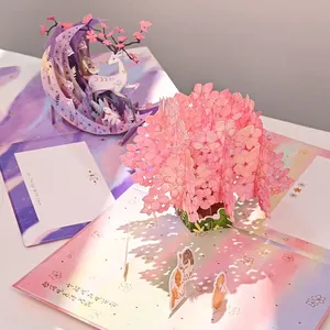 Exquisite macro detail of a laser-cut cherry blossom 3D pop-up greeting card for gifts