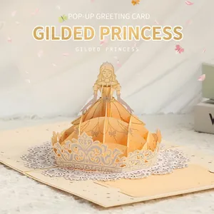 Detailed view of gilded 3D pop-up princess greeting card with intricate paper cutting