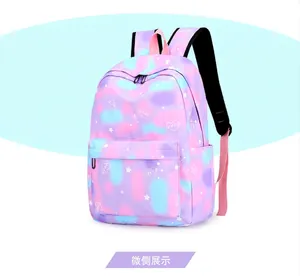 Side view of fashionable galaxy print school backpack for students in purple and pink