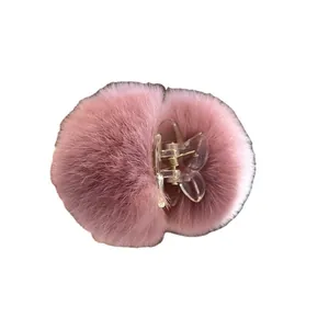 Cute pink fuzzy hair claw clip with plush rabbit fur for autumn and winter styling.