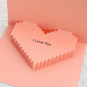 Detailed macro view of pink 3D pop-up heart greeting card with I Love You text message