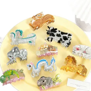 Cute cartoon animal acrylic hair claws set on a yellow plate for girls' hair styling