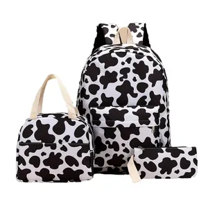 Trendy black and white cow print 3-piece student backpack set with lunch bag and pencil pouch