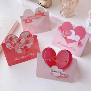 Detail view of 3D heart-shaped Valentine's Day cards in various pink and red tones.