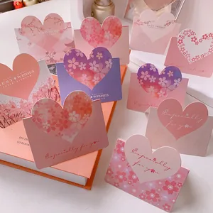 Detailed view of 3D heart-shaped greeting cards with delicate cherry blossom patterns