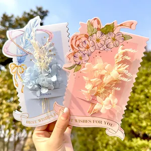Elegant greeting cards with miniature preserved dried flower bouquets and gold foil text