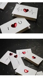 Detailed view of 3D metallic red heart design on elegant white greeting cards