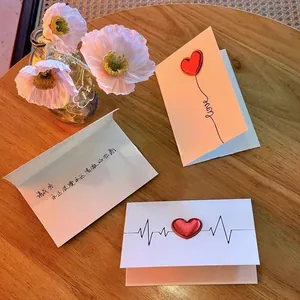 Handmade 3D Valentine's Day greeting card with red leather heart and poppy flowers