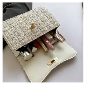 Detailed interior view showing the storage capacity of the white tweed chain bag