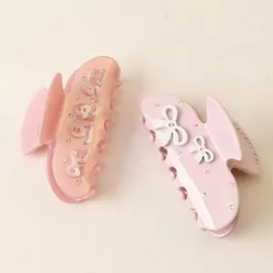 Luxury pink acetate hair claw clips with sparkling rhinestones and elegant white bows