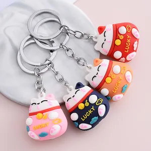 Set of cute 3D cartoon Maneki-neko lucky cat keychains in various vibrant colors