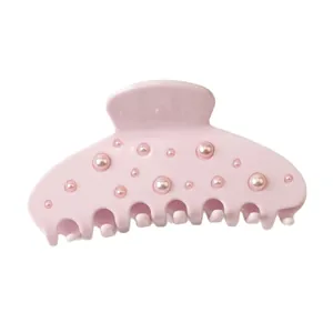 Elegant pink hair claw clip with pearl embellishments for women styling.