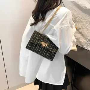 Stylish black and gold tweed plaid small square shoulder bag with elegant golden chain strap