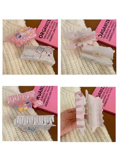 Detailed multiple angle views of cute cartoon dinosaur and dog themed acrylic hair claw clips