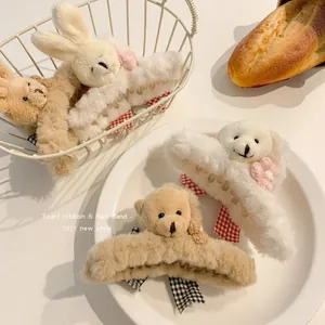 Detailed view of fluffy plush bear and bunny animal hair claws in soft beige and white