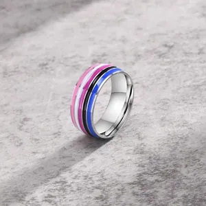 Macro view of a polished stainless steel ring with vibrant colorful stripes
