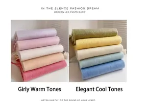 Detailed display of plush warm scarves in various warm and cool tones