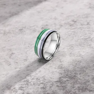 Detailed view of an 8mm silver ring featuring green, white, blue, and black stripes.