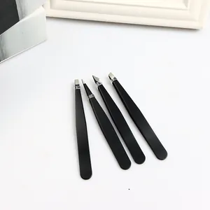 Set of four black stainless steel eyebrow tweezers with various precision tips