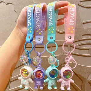 Creative astronaut keychains featuring sunset atmosphere lamps for bags and keys.