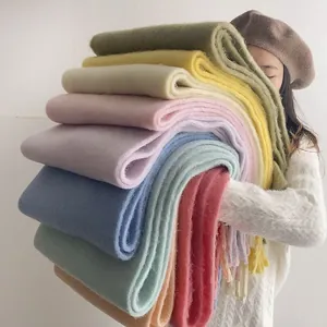 Soft colorful thick imitation cashmere scarves stacked for winter warmth and style