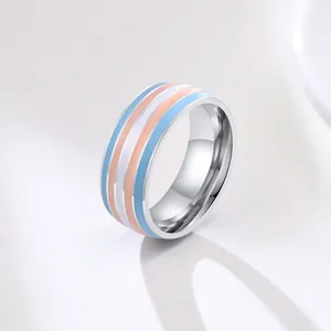 Detailed macro view of a polished stainless steel ring with transgender flag stripes
