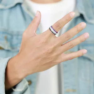 Close-up of a hand wearing an 8mm purple and grey striped enamel band ring for daily wear