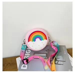 Close-up of a pink silicone children's crossbody bag with a vibrant rainbow design.