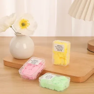Portable flower petal soap paper sheets in colorful travel cases for hand washing.