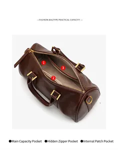 Detailed interior view of retro brown Boston handbag showing three compartments