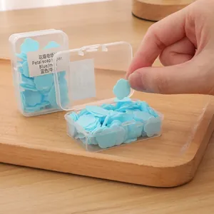 Portable blue flower-shaped petal soap paper in a clear travel case for hand washing