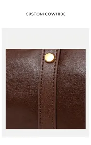 Close-up detail showing the premium cowhide leather texture of a vintage Boston bag