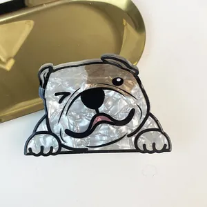 Close-up of a creative bulldog acetate hair claw clip with a shiny pearlescent finish
