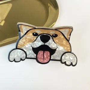 Close-up of cute dog-shaped acetate hair claw clip with pearlescent finish