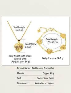 Detail view with size and weight specs for gold-tone heart necklace and bracelet set.