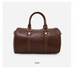 Back view of a vintage brown leather Boston bag showcasing double handle design.