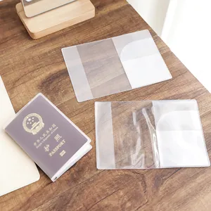 Clear thickened passport cover protector for travel document organization on wooden desk