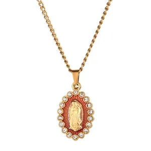 Detailed view of Our Lady of Guadalupe gold pendant with red enamel and crystals