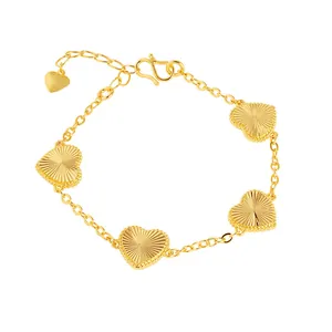 Elegant gold-plated heart bracelet with detailed sunburst engravings for women
