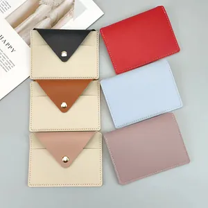 Collection of slim colorful pebbled leather cardholders with snap button closures