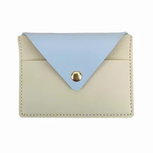 Slim color-blocked card holder with light blue envelope flap and snap.