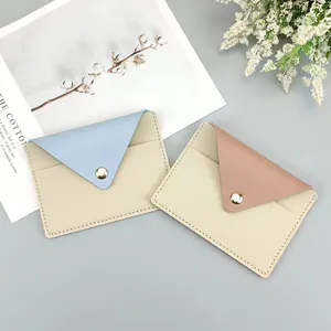 Minimalist slim envelope card holders in pastel blue and pink faux leather finish